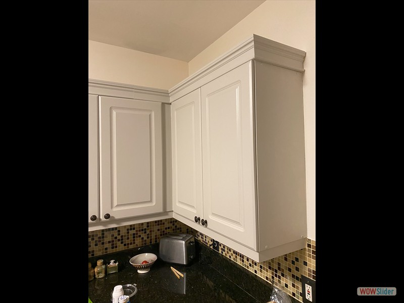 Added crown molding to kitchen cabinets